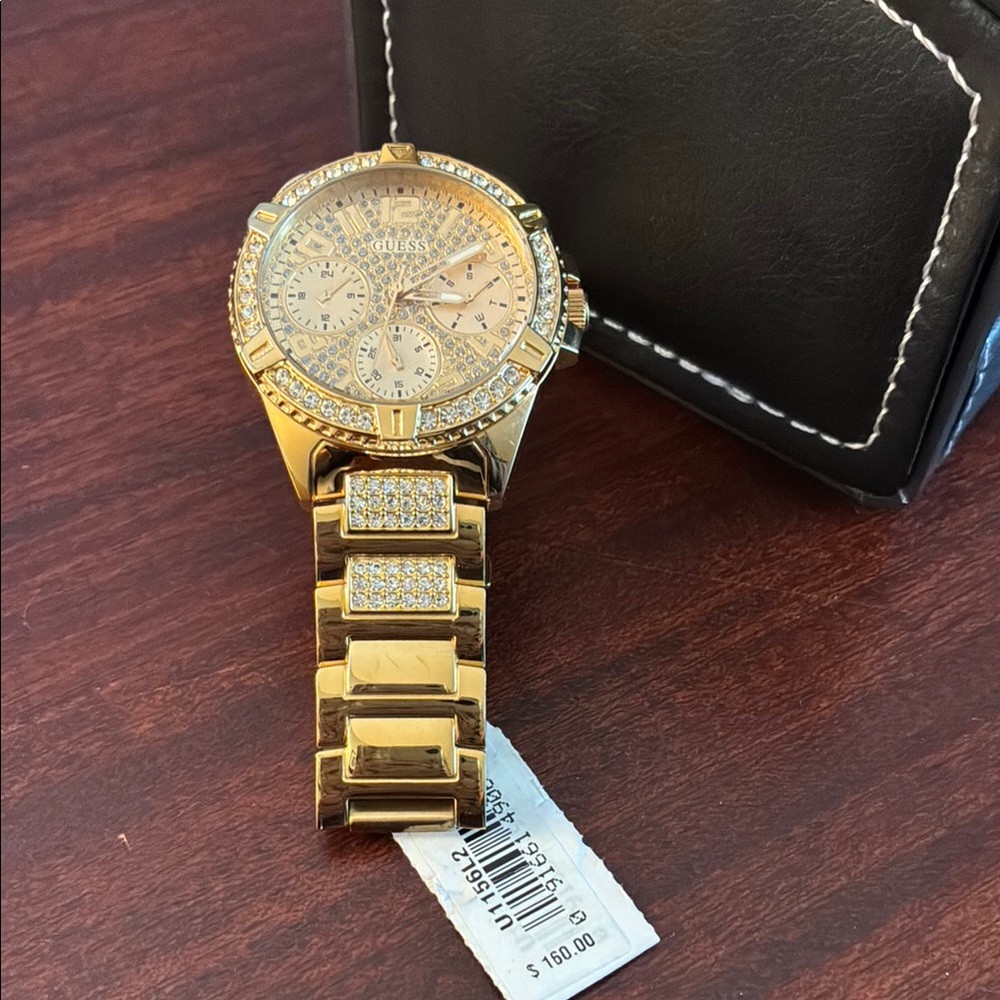 Guess stainless steel gold tone crystal embellished bracelet watch
